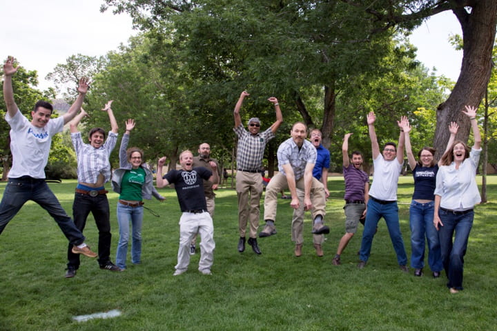 Group of people jumping in air